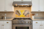 Mosaic artwork with a central yellow sunrise